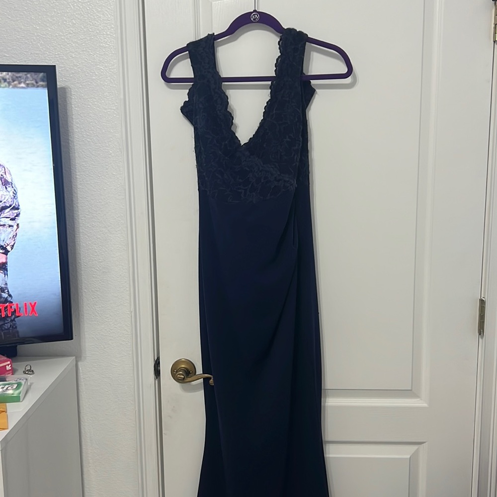 It’s a beautiful blue dress with a lace train